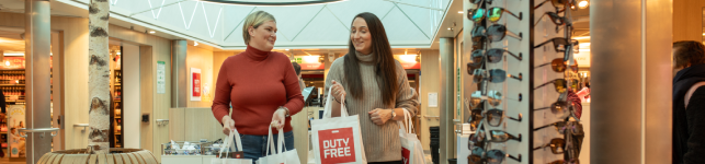 Couple duty free shopping on board ferry